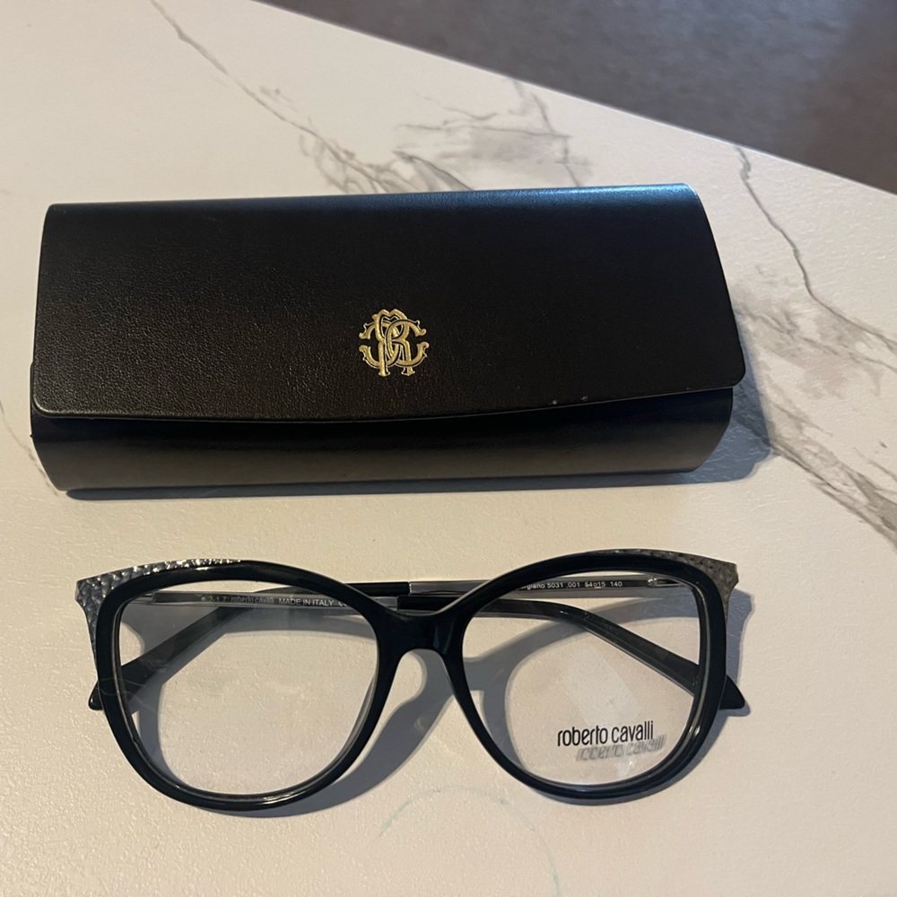 Black and silver authentic glasses.54/15. 140